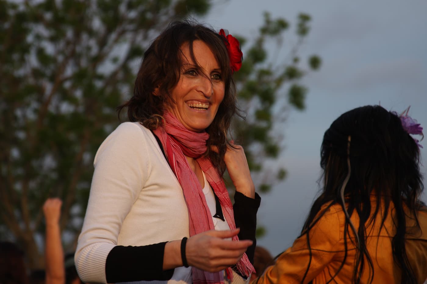 Women dancing during an ederlezi event in Istanbul, captured in a outdoor gathering