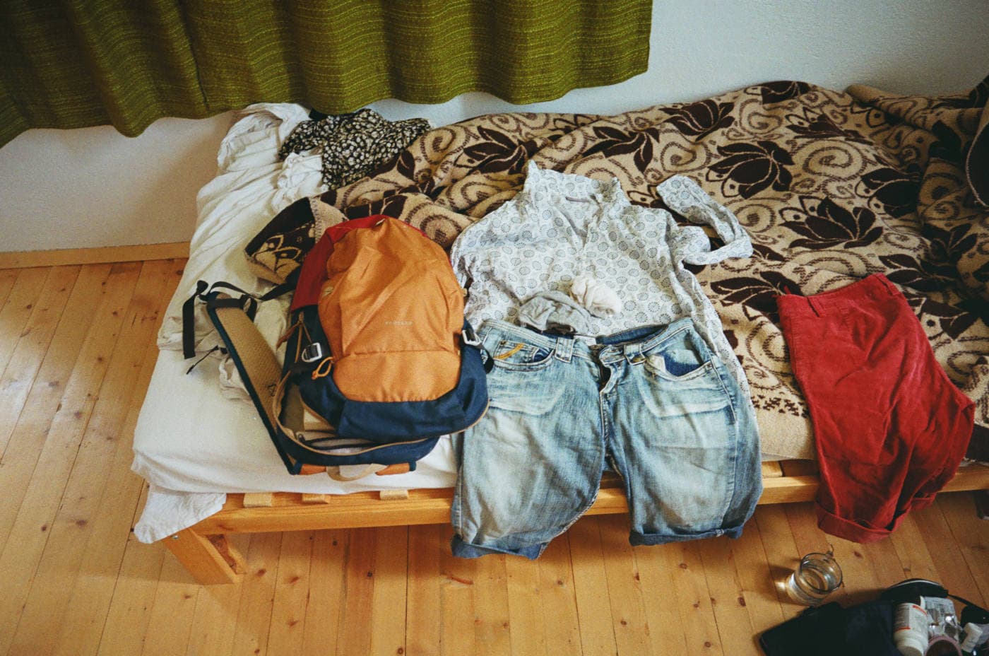 Clothes neatly spread on a bed, prepared for the day