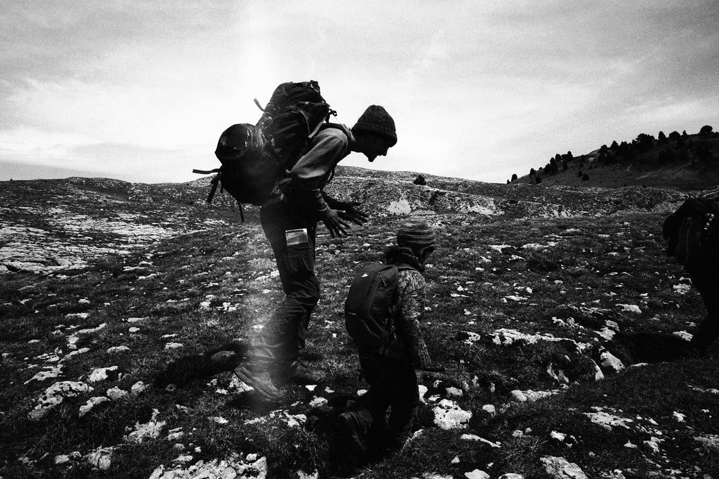 Man and child on a mountain hike talking